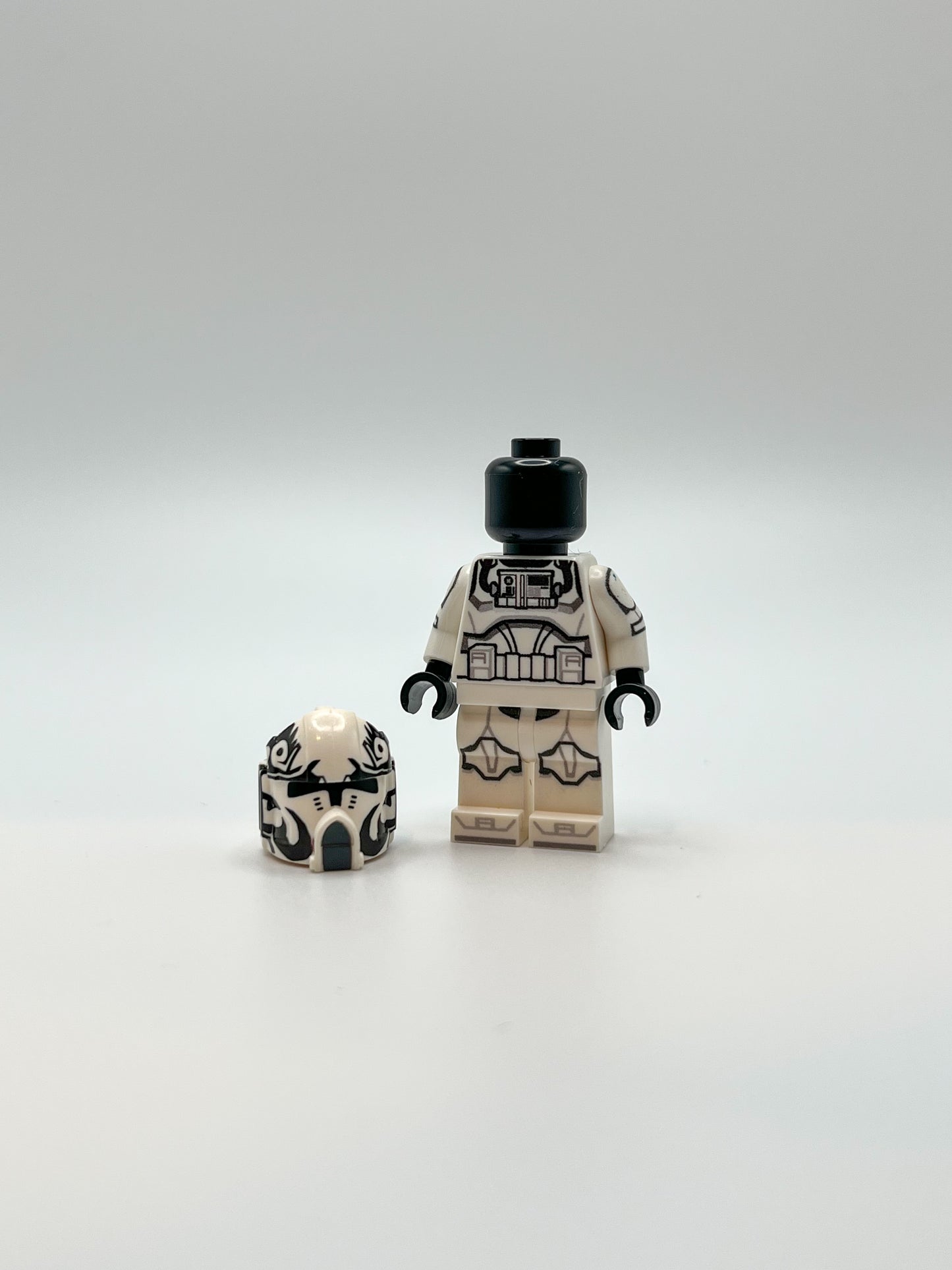 UV Printed LEGO® Clone Wars Pilot with Clone Army Customs helmet on ground next to minifigure